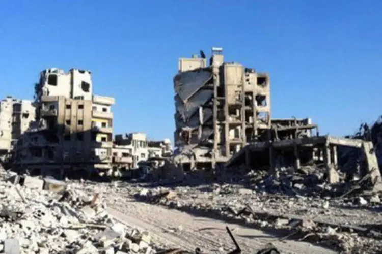 Destruição no bairro sírio de Khaldiyé, em Homs: a tomada da região ocorreu após violentos combates no último setor ocupado pelos rebeldes, segundo o Observatório Sírio de Direitos Humanos (AFP)