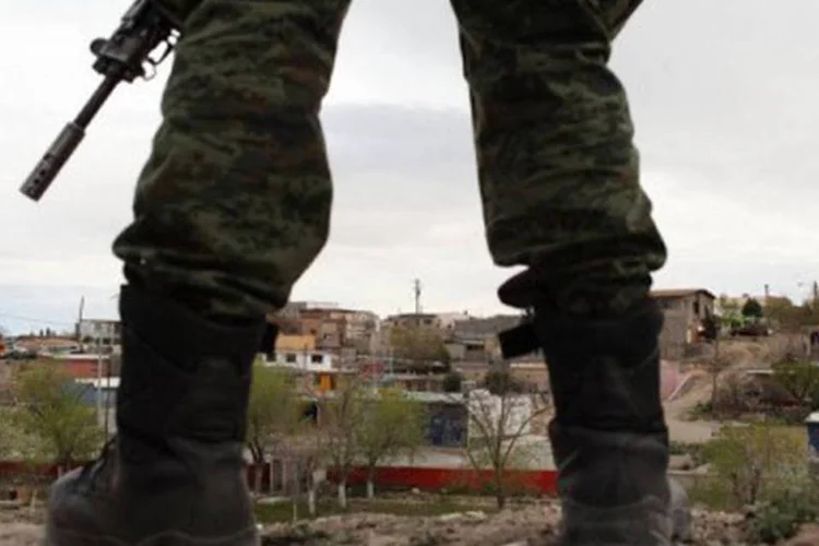 
	Policial guarda o local de crime ocorrido em Juarez
 (©AFP/Getty Images/Arquivo / Spencer Platt)