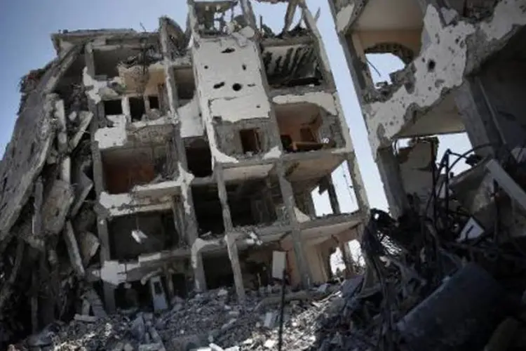 
	Pr&eacute;dios destru&iacute;dos por bombardeios israelenses em Gaza: conflito durou 50 dias
 (Thomas Coex/AFP)