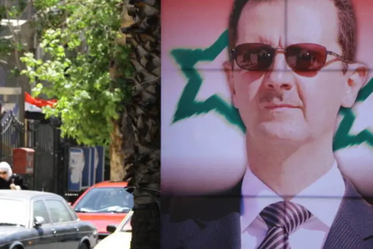 Cartaz de Bashar al-Assad: na semana passada, Assad indultou cerca de 800 réus (AFP/Getty Images)