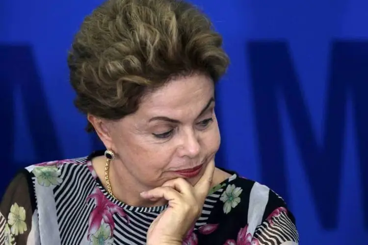 
	Presidente Dilma Rousseff : &quot;Nossa bancada (na C&acirc;mara) est&aacute; quase dividida. Dos 66 membros, h&aacute; no m&iacute;nimo 25 deputados que j&aacute; entenderam a necessidade de mudan&ccedil;a&quot;
 (Ueslei Marcelino/Reuters)