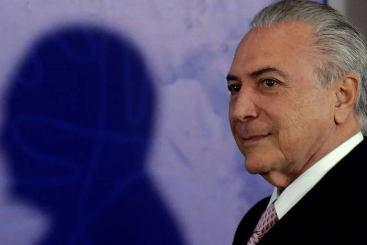 
	Michel Temer: segundo dois senadores do PMDB que estiveram com Temer nesta segunda-feira, 29, presidente interino j&aacute; d&aacute; o impeachment como certo
 (Ueslei Marcelino/Reuters)