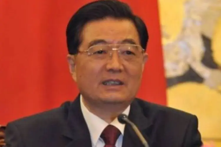 Presidente Hu Jintao: Para chineses, estratégia de Obama resume-se à "impressão desenfreada de dinheiro" (AFP Kota Kyogoku/EXAME.com)