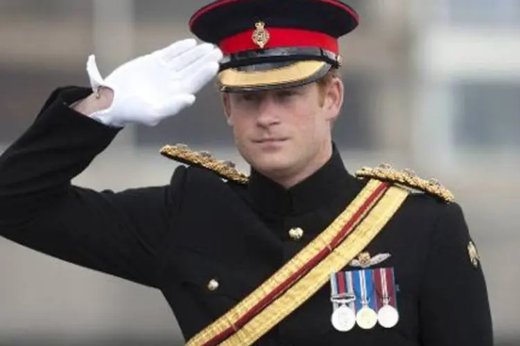 O príncipe Harry anunciou que pedirá baixa do Exército britânico, após 10 anos de serviço, durante os quais combateu duas vezes no Afeganistão (Eddie Mulholland/AFP)