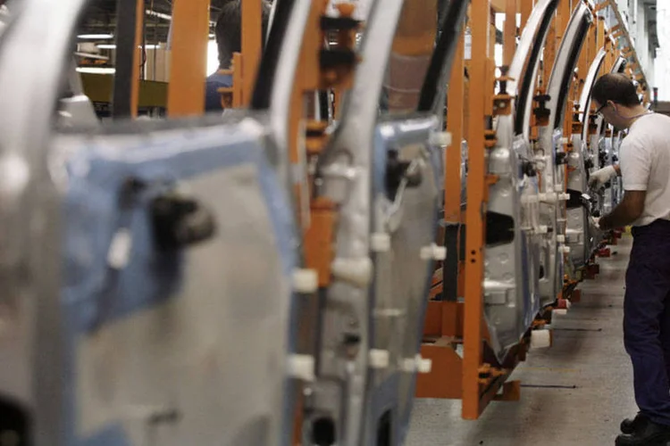 
	Trabalhadores na linha de montagem da General Motors (GM)
 (Diego Giudice/Bloomberg News)