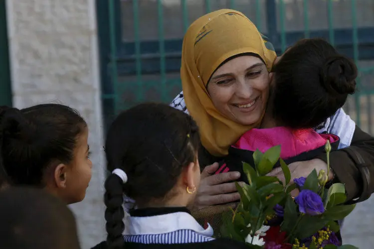 
	Hanan Al Hroub: &quot;Eu ganhei. A Palestina ganhou. Todos n&oacute;s temos o poder, n&oacute;s podemos mudar o mundo&quot;, disse a professora
 (Mohamad Torokman/Reuters)
