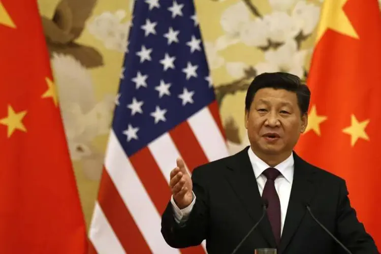 
	O presidente chin&ecirc;s, Xi Jinping, durante seu dicurso a executivos norte-americanos: &quot;A economia da China permanecer&aacute; em um ritmo constante de crescimento bastante r&aacute;pido. Nossa economia est&aacute; sob press&atilde;o, mas isso &eacute; parte do caminho para o crescimento&quot;
 (REUTERS)
