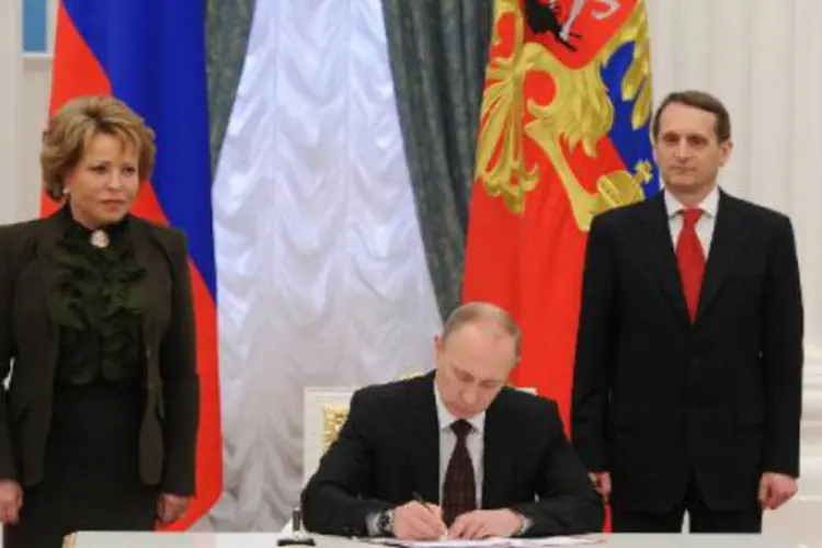 Putin assina uma lei que ratifica o acordo que torna a Crimeia parte da Rússia: reivindicação de Putin sobre Crimeia pegou a administração americana de surpresa (Mikhail Klimentyev/AFP)