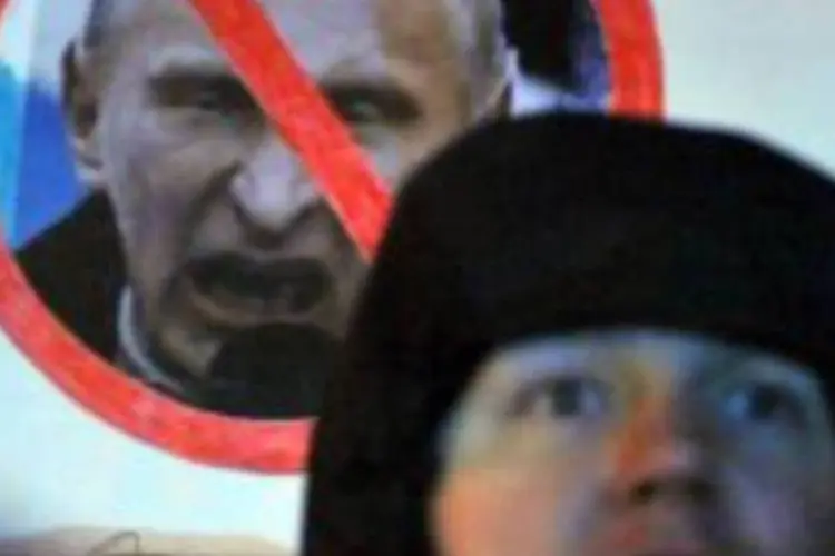 Opositores protestam contra Putin neste domingo em Moscou (AFP/ Sergei Supinsky)