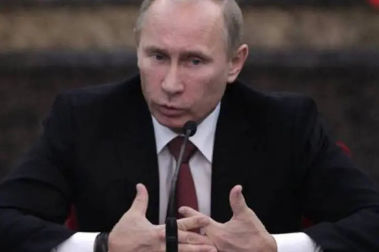 Vladimir Putin, presidente russo: Putin acredita que a solução para o conflito sírio não está na troca do poder entre os dirigentes sírios e a oposição armada (Jason Lee/AFP)