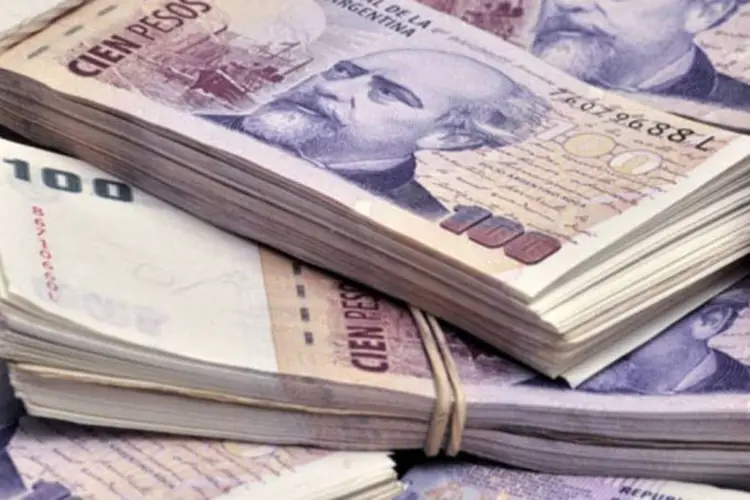 
	Pesos argentinos: Argentina manifestou a vontade de pagar credores, mas afirmou isso provocaria novo default
 (Diego Giudice/Bloomberg)