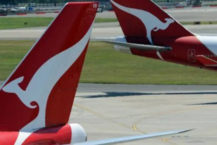 Aviões da australiana Qantas: funcionária da companhia pilotaria um Boeing 767  e recebeu a ordem de retornar para ser submetida a um exame de alcoolemia, que deu resultado positivo (Torsten Blackwood/AFP)