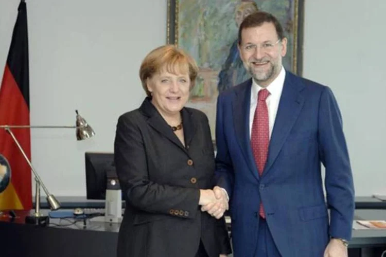 Em uma conversa de 20 minutos Merkel cobrou medidas rápidas e eficientes de Mariano Rajoy, recém-eleito primeiro ministro da Espanha (Getty Images)