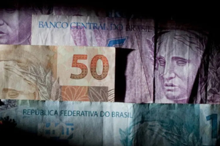 
	Dinheiro: o cr&eacute;dito voltado para investimentos continuar&aacute; crescendo, como os empr&eacute;stimos feitos pelo Banco Nacional de Desenvolvimento Econ&ocirc;mico e Social (BNDES) e os liberados para financiar a habita&ccedil;&atilde;o
 (Andrew Harrer/Bloomberg)