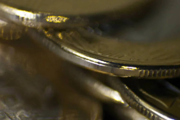 
	Dinheiro: a moeda mais exclusiva &eacute; uma pe&ccedil;a de ouro de 16 mil&iacute;metros de di&acirc;metro, com valor nominal de R$ 10, que ser&aacute; vendida por R$ 1.180
 (Dado Galdieri/Bloomberg)