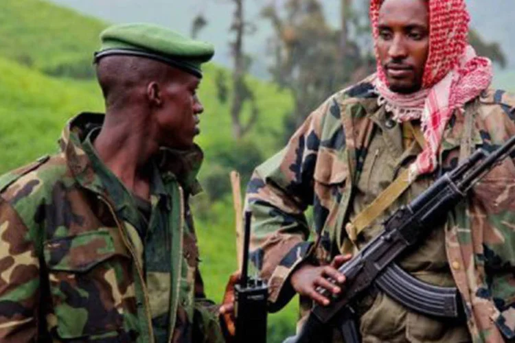 
	Rebeldes do M23, da RDC: o documento da ONU acusa o ministro da Defesa de Ruanda, James Kabarebe, de instruir pessoalmente os guerrilheiros do M23
 (©AFP/File / Melanie Gouby)