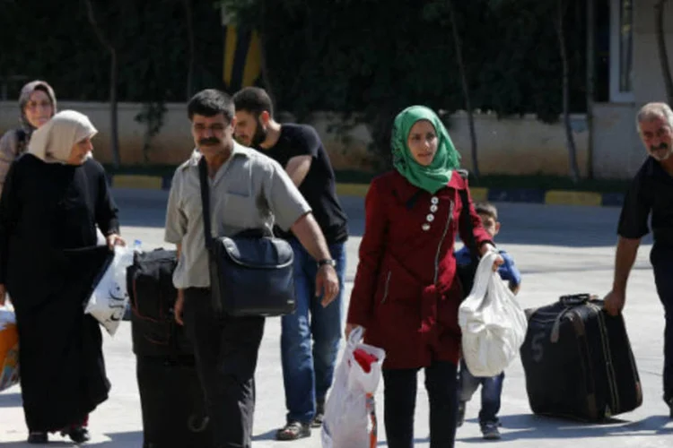 
	Refugiados s&iacute;rios: muro&nbsp;dificulta a rela&ccedil;&atilde;o entre os curdos de ambos os pa&iacute;ses
 (REUTERS/Umit Bektas)