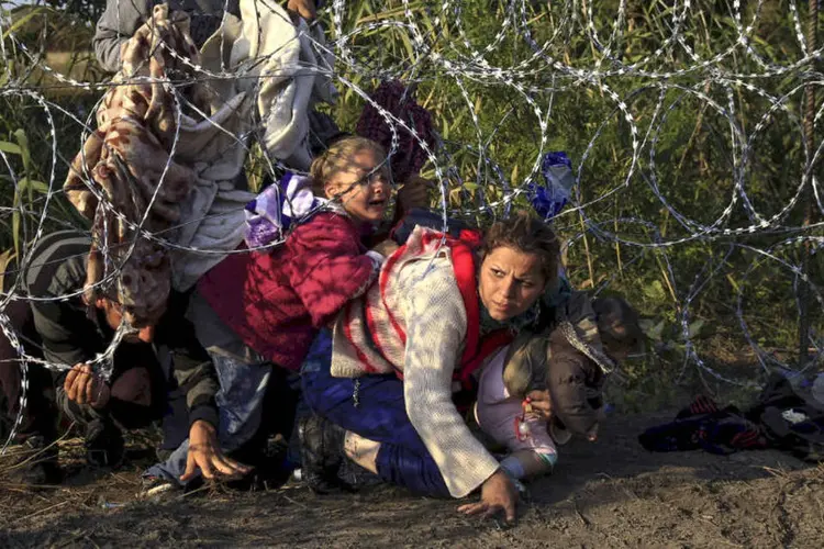 
	Refugiados na Hungria: ao todo, 5.749 pessoas morreram ao tentar cruzar fronteiras em diversas partes do mundo nos &uacute;ltimos 12 meses, diz relat&oacute;rio da organiza&ccedil;&atilde;o
 (REUTERS/Bernadett Szabo)