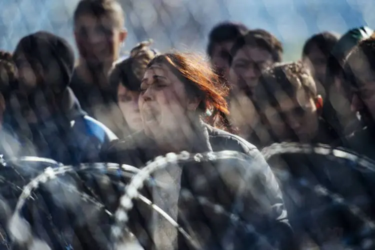 
	Refugiados: &quot;Al&eacute;m disso, as restri&ccedil;&otilde;es de fronteira violam a lei internacional e a lei europeia&quot;
 (Dimitar Dilkoff / AFP)