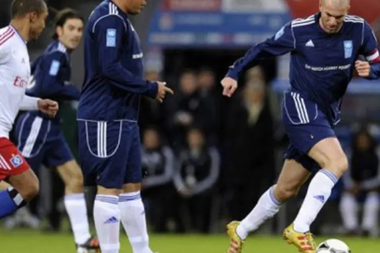 
	Ronaldo e Zidane em partida de futebol: Zidane, que jogar&aacute; pela primeira vez no Brasil, comemorou o fato de &quot;jogar contra um velho amigo em Porto Alegre&quot;
 (©AFP / Oliver Hardt)