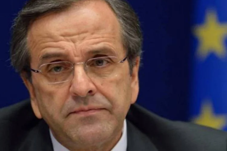 
	O primeiro-ministro grego, Antonis Samaras: &quot;se o acordo for aprovado e o or&ccedil;amento votado, a Gr&eacute;cia permanecer&aacute; na zona do euro e sair&aacute; da crise&quot;
 (Eric Feferberg/AFP)
