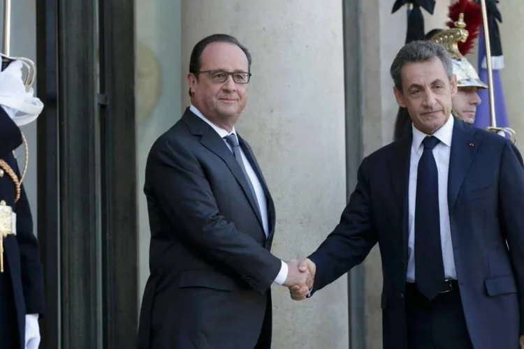 
	Sarkozy e Hollande: &quot;A &uacute;nica coisa que importa &eacute; que amanh&atilde; os franceses se sintam seguros. Hoje n&atilde;o &eacute; assim&quot;, disse o ex-presidente da Fran&ccedil;a
 (REUTERS/Philippe Wojazer)