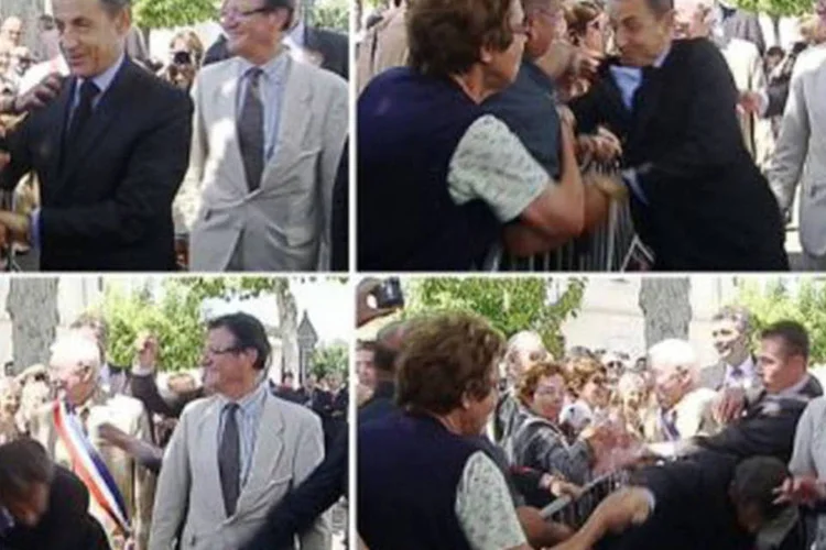 Sequência de fotos mostra o momento em que Sarkozy foi agarrado pelo desconhecido
 (AFP)