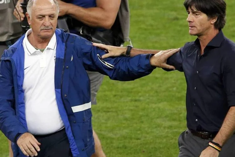 
	Felip&atilde;o e Joachim L&ouml;w ap&oacute;s goleada da Alemanha, no Mineir&atilde;o
 (David Gray/Reuters)