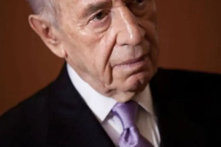 
	Shimon Peres: os cr&iacute;ticos ao presidente consideram que a tomada de posi&ccedil;&atilde;o de Peres ultrapassa o seu cargo, que n&atilde;o lhe concede poder de decis&atilde;o
 (Brendan Smialowski/AFP)