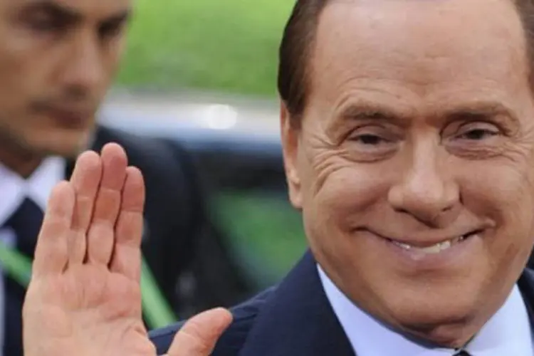 "Outra razão para investir na Itália: temos belas secretárias", disse Berlusconi em 2003, durante visita a investidores norte-americanos (Eric Feferberg/AFP)