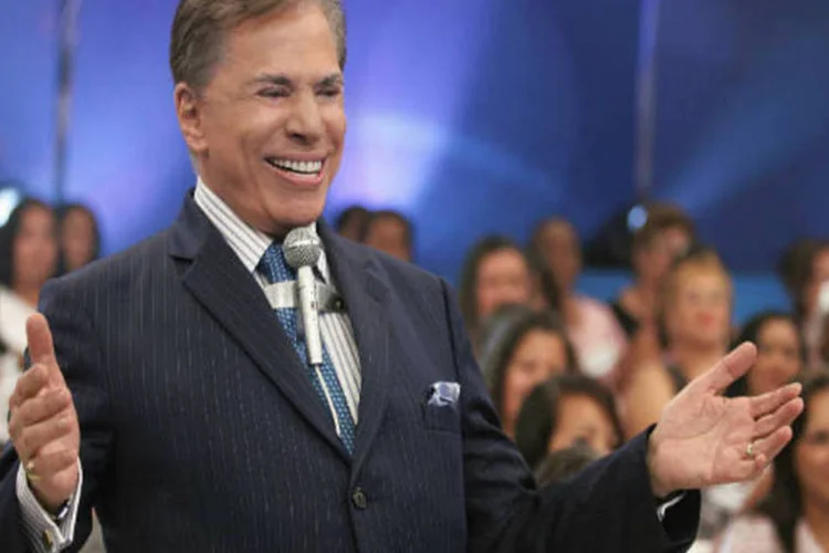 
	Silvio Santos, apresentando seu programa, no SBT: n&atilde;o se trata, obviamente, do programa do Governo Federal
 (Roberto Nemanis/Divulgação)