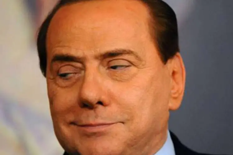 O ex-primeiro-ministro italiano Silvio Berlusconi: Além da pena de prisão, Berlusconi está proibido durante três anos de desempenhar cargos em entidades jurídicas (©AFP / Christophe Simon)