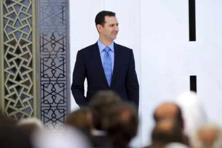 
	O presidente s&iacute;rio, Bashar al-Assad: &quot;Se o povo s&iacute;rio quiser que eu esteja no poder, ent&atilde;o estarei, e se n&atilde;o quiser, ent&atilde;o n&atilde;o estarei&quot;, disse Assad
 (AFP)