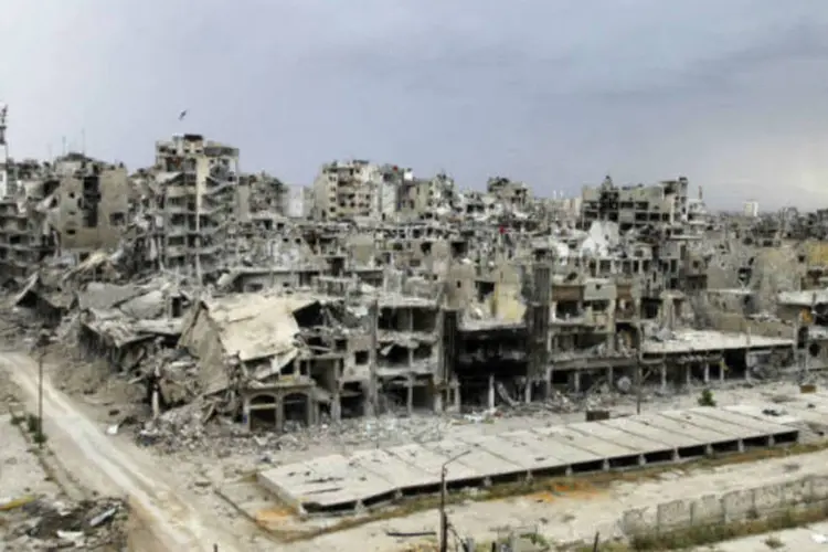 
	Homs: ap&oacute;s o ataque, o regime conseguiu recuperar partes do campo
 (REUTERS/Ghassan Najjar/Reuters)