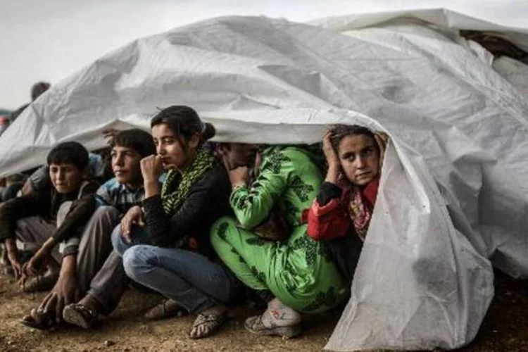 
	Refugiados: guerra civil na S&iacute;ria provocou maior crise de refugiados desde genoc&iacute;dio de 1994 em Ruanda
 (Bulent Kilic/AFP)
