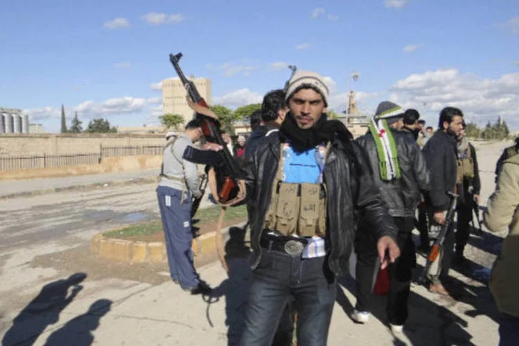 
	Rebelde s&iacute;rio: confrontos entre tropas de Assad e rebeldes se intensificam nas proximidades do aeroporto de Damasco
 (Network/Handout)