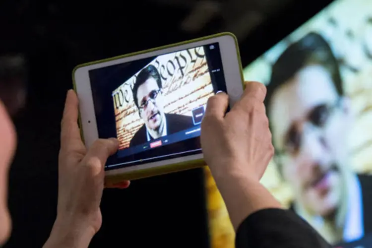 
	Edward Snowden aparece em v&iacute;deo-confer&ecirc;ncia durante a South by Southwest em Austin: ex-agente da NSA fugiu para Moscou no ano passado
 (David Paul Morris/Bloomberg)