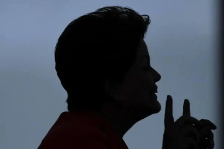 
	Presidente Dilma obscurecida por uma sombra
 (Ueslei Marcelino/Reuters)
