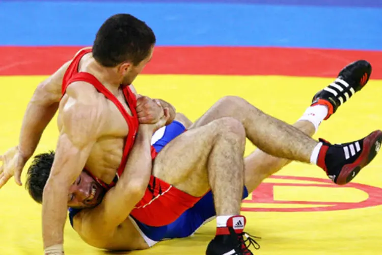 
	Soslan Tigiev (vermelho) luta nas Olimp&iacute;adas 2012
 (Getty Images)