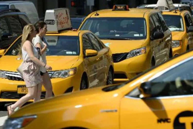 
	T&aacute;xis em Nova York: o debate no setor de t&aacute;xis de NY, avaliado em US$ 15 bilh&otilde;es, que come&ccedil;ou com a chegada da Uber, prossegue com os credores retirando seu apoio
 (Timothy A. Clark/AFP)