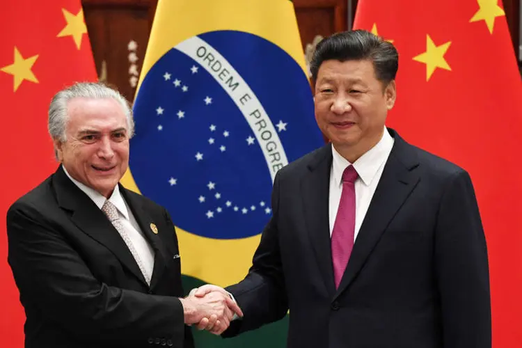 
	Temer e Xi Jinping: &quot;O Brasil deixa resolutamente para tr&aacute;s toda a instabilidade econ&ocirc;mica e pol&iacute;tica que sofreu nos &uacute;ltimos anos&quot;
 (Minoru Iwasaki/Pool/Reuters)
