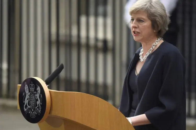 
	Theresa May: Primeira-ministra j&aacute; tinha rejeitado um sistema de &quot;pontua&ccedil;&atilde;o&quot; para selecionar imigrantes que entram no pa&iacute;s
 (Toby Melville / Reuters)