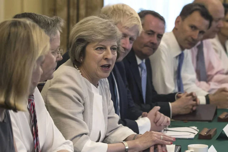 
	Theresa May: &quot;Isto ir&aacute; significar controle de n&uacute;mero de pessoas que vem da Europa para o Reino Unido&quot;
 (Dan Kitwood / Reuters)