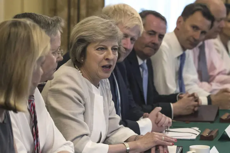 
	Theresa May: &quot;espero que iremos tamb&eacute;m cobrir uma s&eacute;rie de outras quest&otilde;es internacionais importantes&quot;, disse May ao Parlamento
 (Dan Kitwood / Reuters)