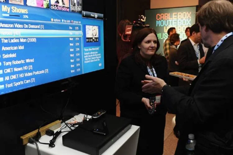 
	Expositor mostra o funcionamento do Tivo em feira de tecnologia: &eacute;&nbsp;empresa respons&aacute;vel pelo mais popular dispositivo de grava&ccedil;&atilde;o de conte&uacute;do da programa&ccedil;&atilde;o da TV
 (Theo Wargo/Getty Images)