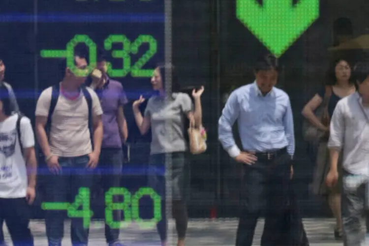 
	Bolsa de T&oacute;quio: &iacute;ndice japon&ecirc;s Nikkei fechou com queda de 1,27 por cento mas o de Hong Kong avan&ccedil;ou 0,29 por cento
 (Yuriko Nakao/Bloomberg)