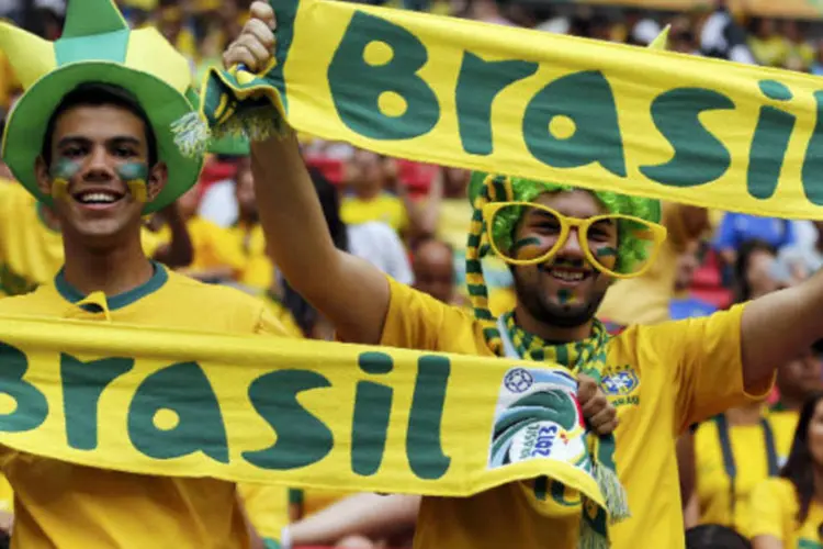 
	Torcedores brasileiros durante a abertura da Copa das Confedera&ccedil;&otilde;es:&nbsp;quem n&atilde;o recebeu boleto deve entrar em contato com o centro de ingressos pelo telefone 0300 021 2014
 (REUTERS/Jorge Silva)