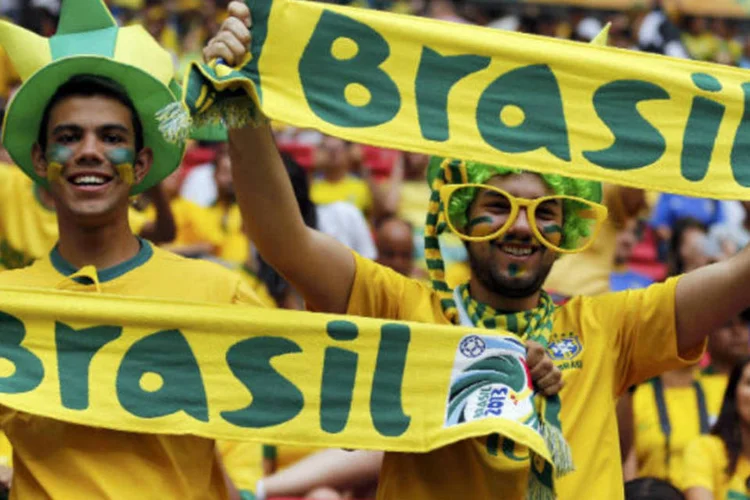 
	Torcedores brasileiros durante a abertura da Copa das Confedera&ccedil;&otilde;es:&nbsp;equipamentos e tecnologias ficar&atilde;o como legado para as for&ccedil;as de seguran&ccedil;a, diz governo
 (REUTERS/Jorge Silva)