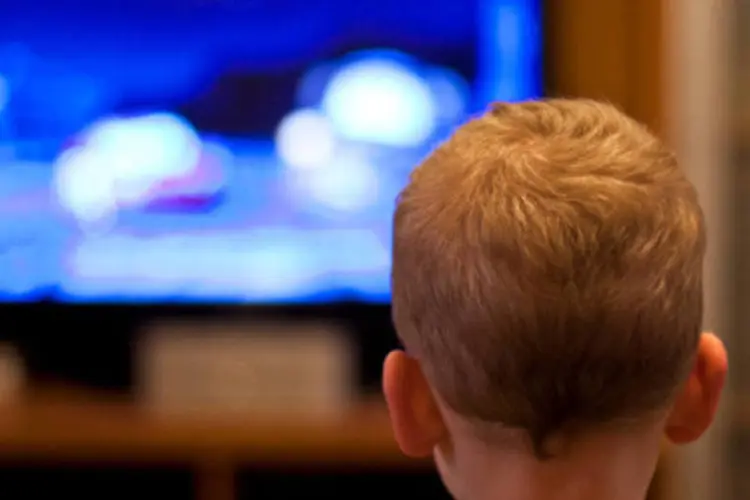 
	Pol&iacute;ticos e canais de TV: durante discurso do ministro, manifestantes estenderam a faixa &quot;pol&iacute;tico n&atilde;o pode ter TV. Revoga Paulo Bernardo&quot;
 (Getty Images)