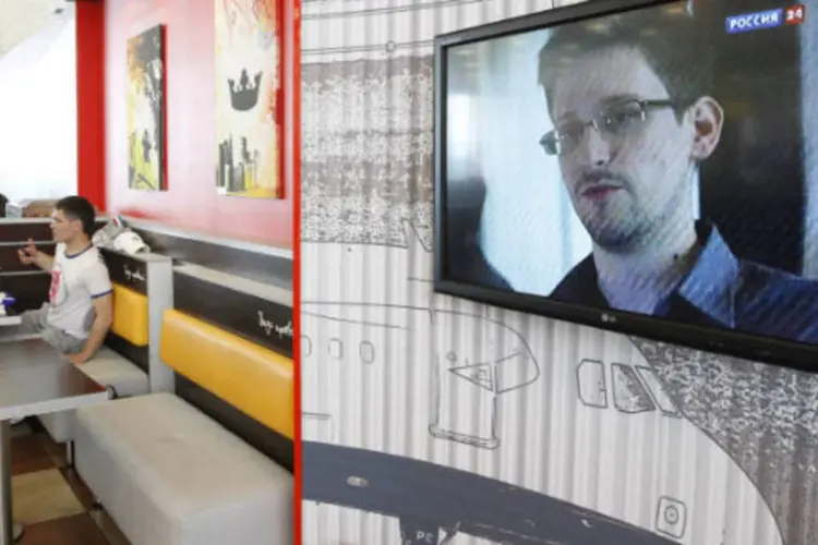 Televisão exibe em aeroporto reportagem sobre Edward Snowden, procurado nos EUA por divulgar detalhes de programas secretos de vigilância  (REUTERS / Sergei Karpukhin)